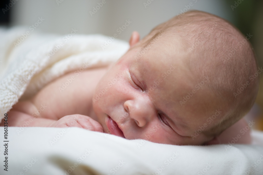 Adorable beautiful newborn baby girl. Maternity and newborn concept. Newborn baby is sleeping Adorable beautiful newborn baby girl. Maternity and newborn concept. Newborn baby is sleeping