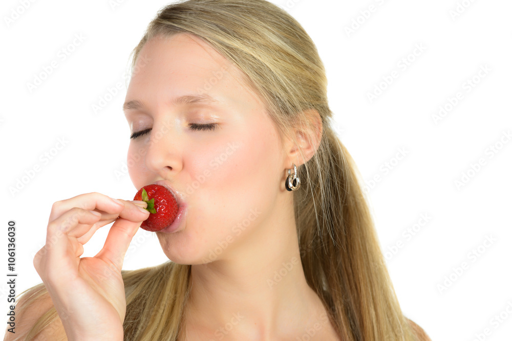 Portrait of a thoughtful blond beauty eating strawberries Portrait of a thoughtful blond beauty eating strawberries