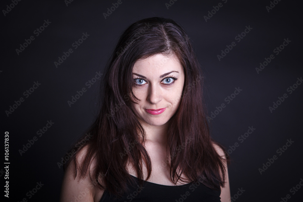 studio portrait of a beautiful woman on a dark background studio portrait of a beautiful woman on a dark background