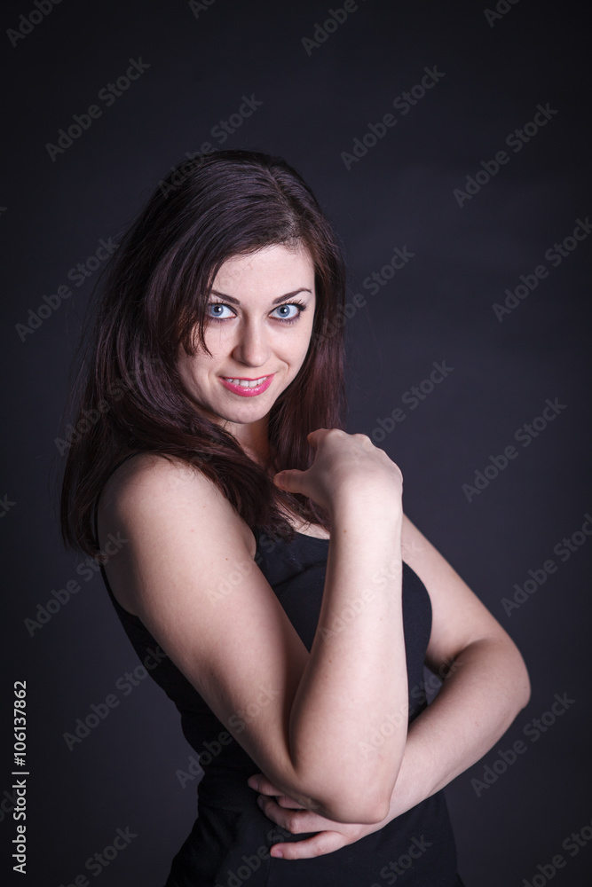 studio portrait of a beautiful woman on a dark background studio portrait of a beautiful woman on a dark background