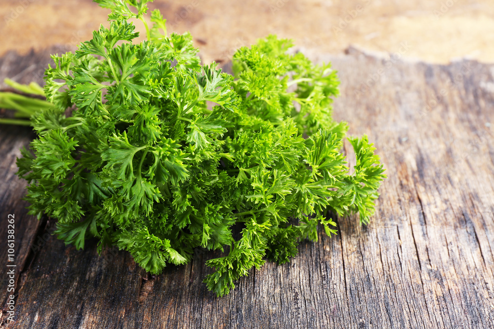 Fresh parsley on wooden background Fresh parsley on wooden background