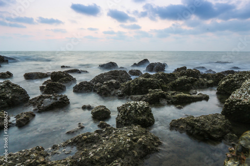 Coastal twilight scene, Long Exposure of rocks and waves at suns