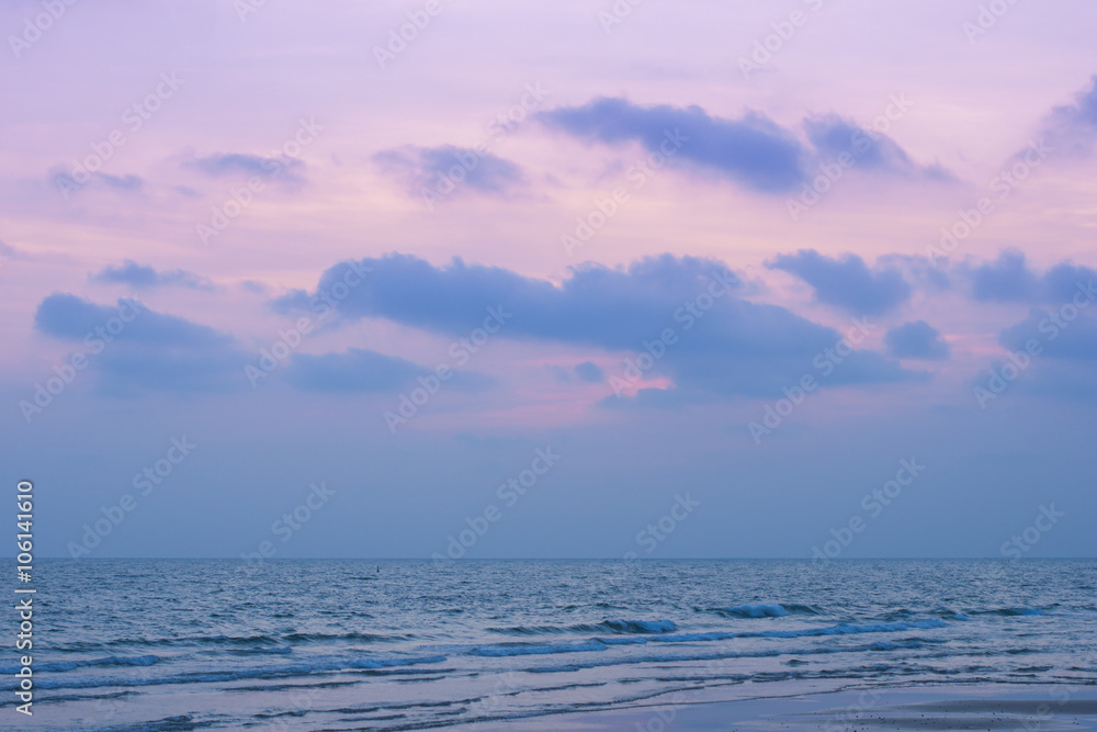 Sunset above sea beach with rose quartz and serenity tone