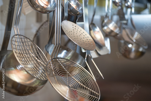 strainers ladles and kitchen accessories hanging