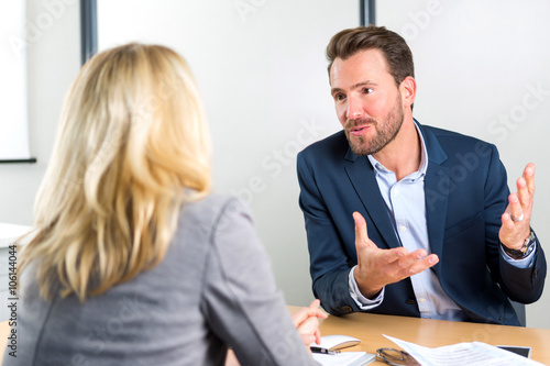 Young attractive employer doing a job interview to a woman
