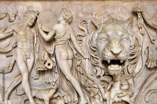 Bas-relief and sculpture of ancient Roman Gods and a lion head