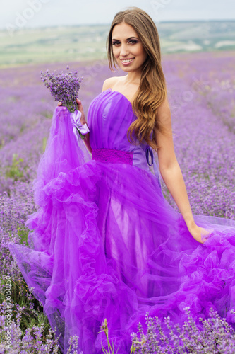 Purple dream, girl in a field of lavender flowers