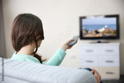 Young beautiful woman watch...