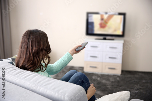 Young beautiful woman watch...