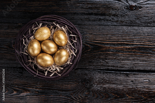 Golden eggs in a nest