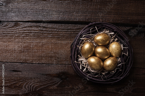 Golden eggs in a nest