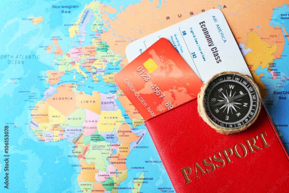 Credit cards with passport and tickets for vacations on the world map background Credit cards with passport and tickets for vacations on the world map background