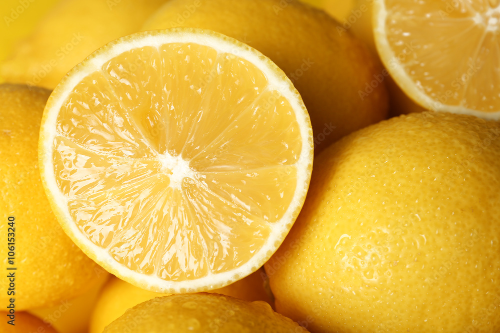 Pile of wet lemons with halves closeup Pile of wet lemons with halves closeup