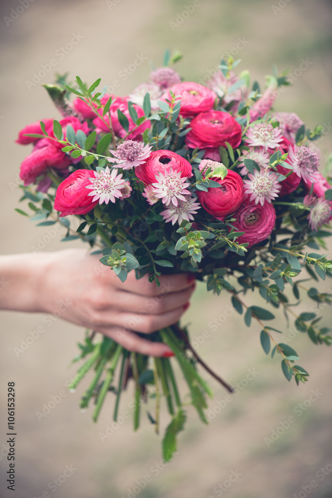 Wedding bouquet close-up, beautiful tender wedding bouquet of mixed flowers and in hands of the bride Wedding bouquet close-up, beautiful tender wedding bouquet of mixed flowers and in hands of the bride