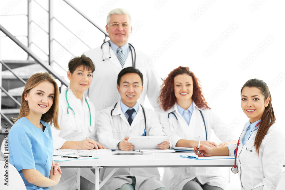 Team of doctors at working place indoors Team of doctors at working place indoors