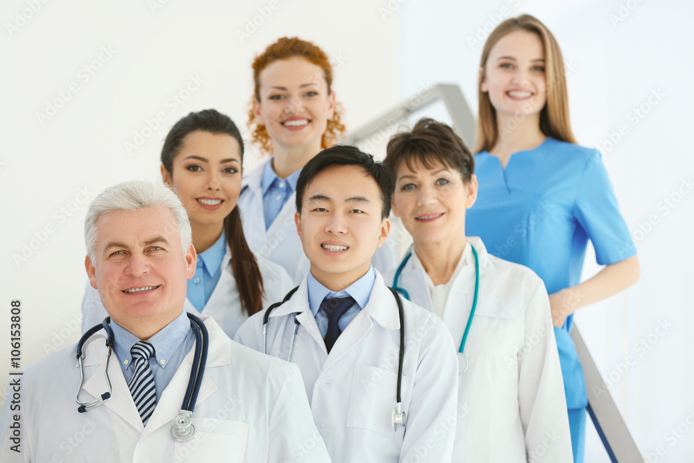 Team of smiling doctors indoors Team of smiling doctors indoors