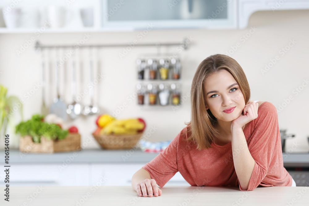Young woman in the kitchen Young woman in the kitchen