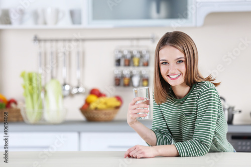 Young woman with glass of w...