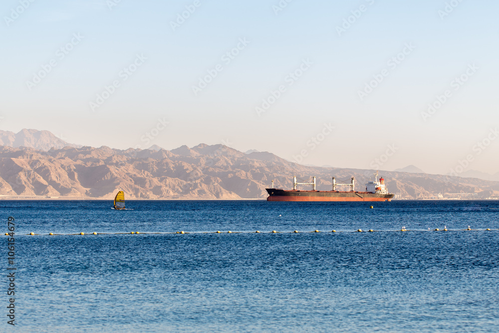 Cargo ship wind surfing vessel Red sea Israel.