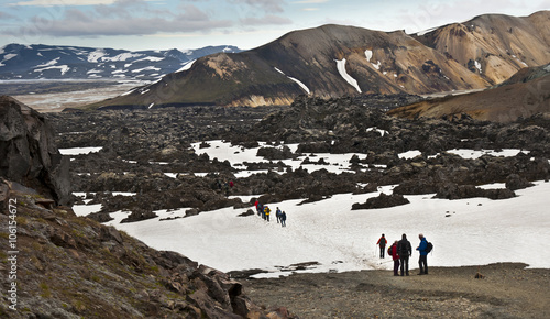 Group of people walking in lava field, tour from Landmannalaugar to Thorsmork and Skogar, Iceland © kojin_nikon