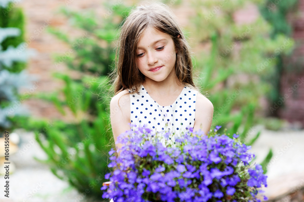 Adorable smiling kid girl with flowers Adorable smiling kid girl with flowers