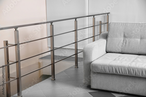 Grey sofa in the room, clos...