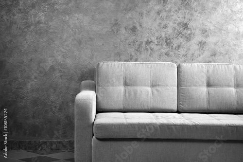 Comfortable sofa against gr...