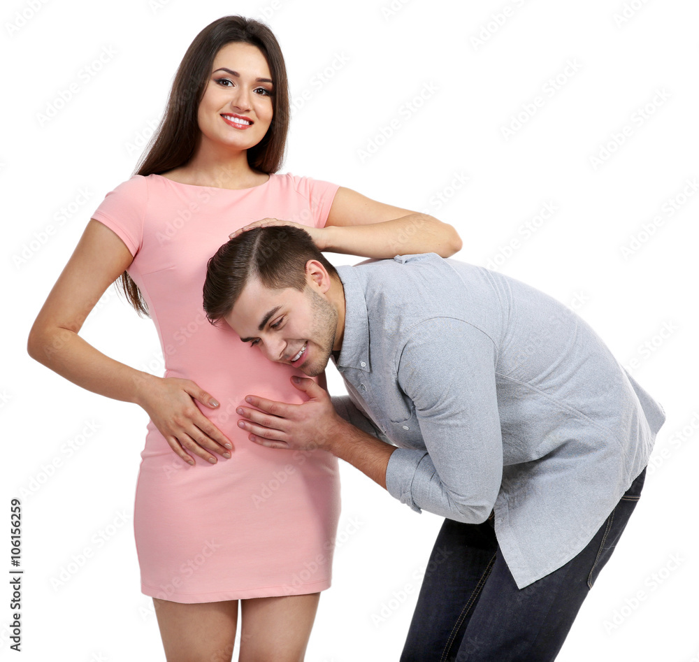 Young pregnant woman with husband isolated on white Young pregnant woman with husband isolated on white