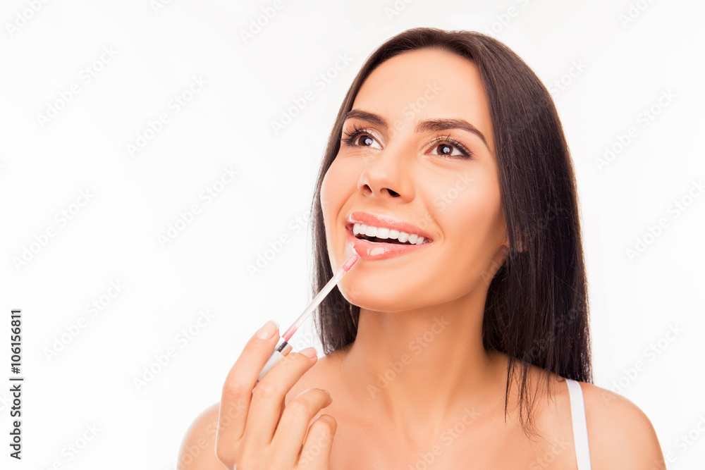 Young woman doing maquillage with lipstick, close up photo Young woman doing maquillage with lipstick, close up photo