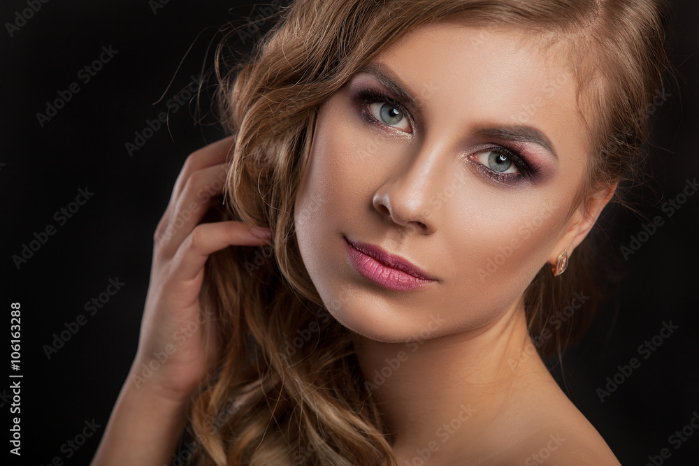Beauty model girl with perfect make-up isolated over white. Portrait of attractive young woman with blond hair on white background. Beautiful female face with clear fresh skin Beauty model girl with perfect make-up isolated over white. Portrait of attractive young woman with blond hair on white background. Beautiful female face with clear fresh skin