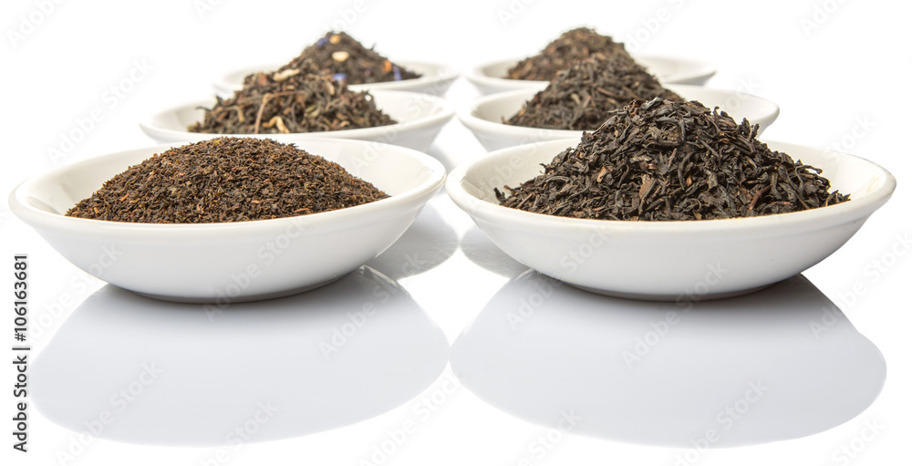 Dried variety of black tea leaves in white bowl over white background Dried variety of black tea leaves in white bowl over white background