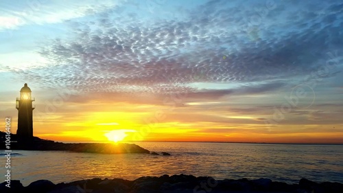 Lighthouse on the coast at sunrise