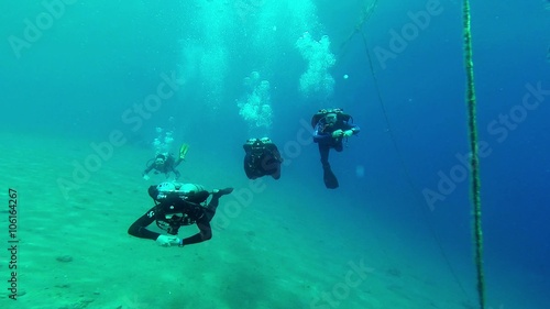Wallpaper Mural a Couple of Swimmers Swim Towards Ropes in Clean Sea Water Torontodigital.ca