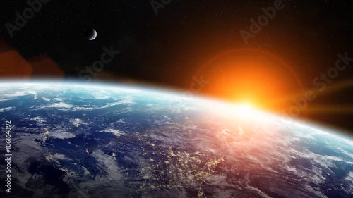 Obraz Wschód słońca nad planetą Ziemią w kosmosie