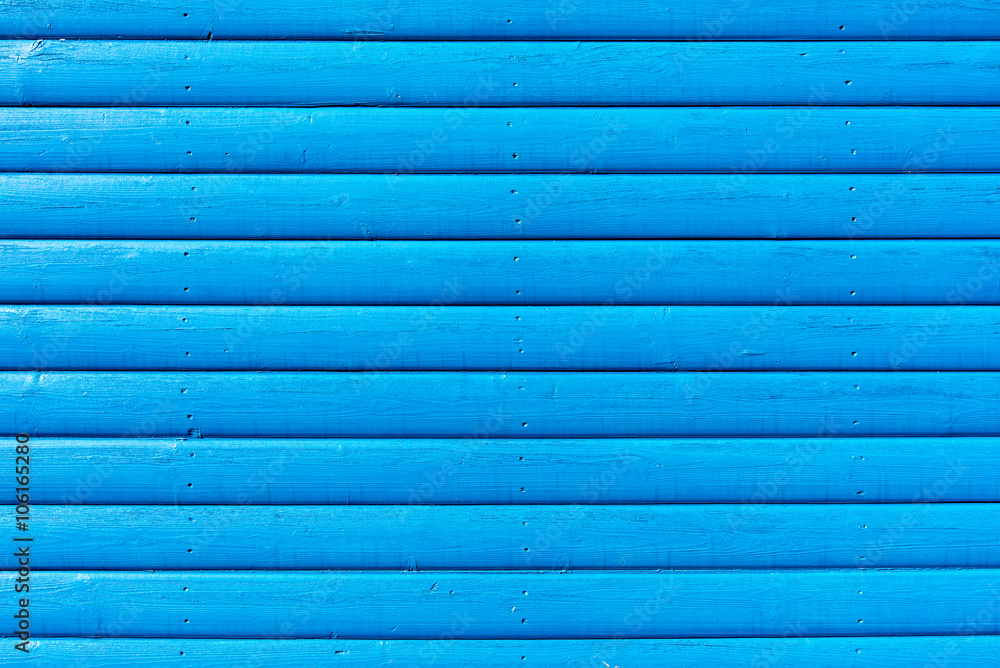 Section of blue wood panelling from a beach hut, suitable for backgrounds of beach, seaside and summer holiday themes. Section of blue wood panelling from a beach hut, suitable for backgrounds of beach, seaside and summer holiday themes.