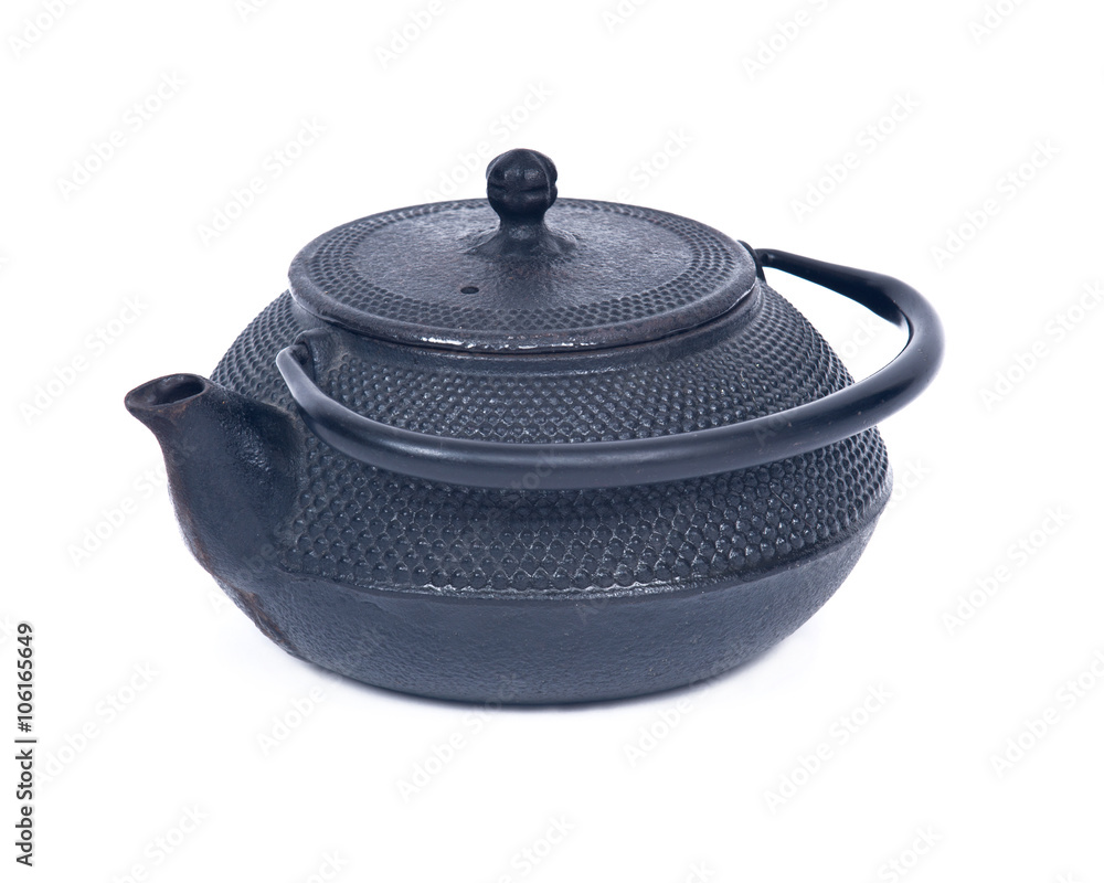 Old cast iron tea pot separated on white background Old cast iron tea pot separated on white background