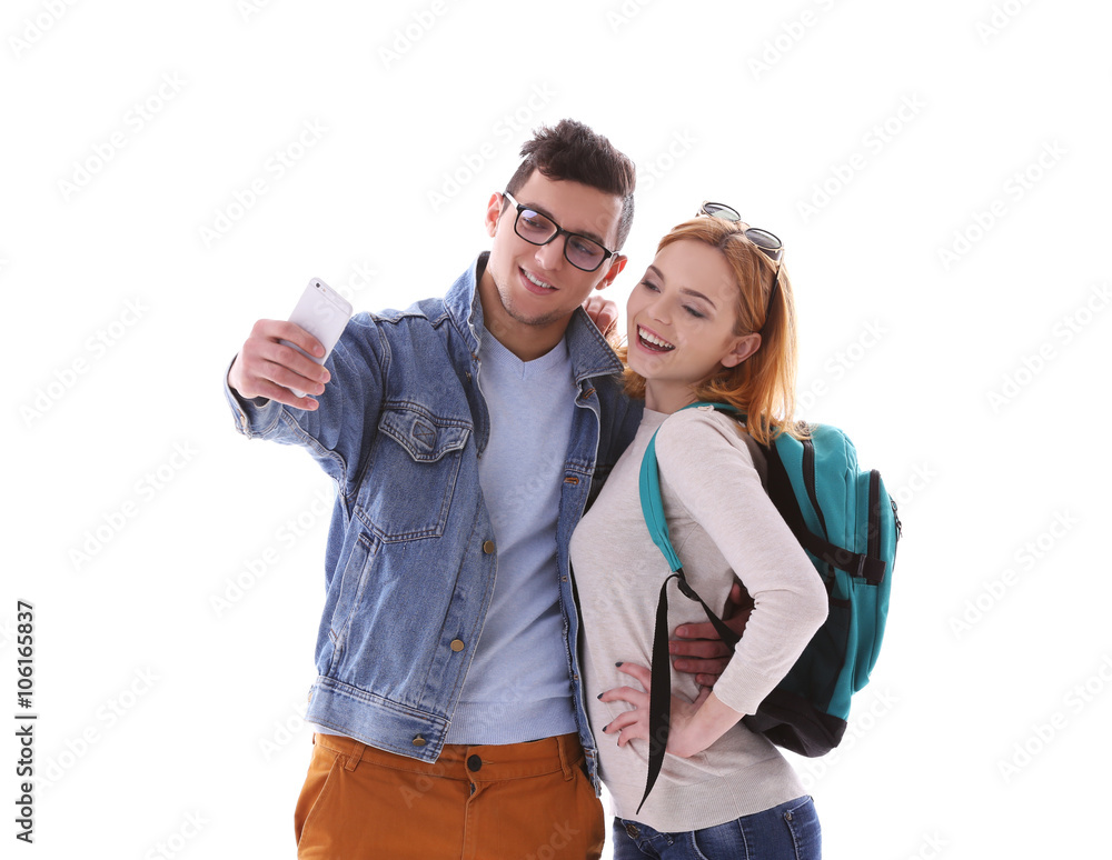 Young couple taking selfie with mobile phone isolated on white Young couple taking selfie with mobile phone isolated on white