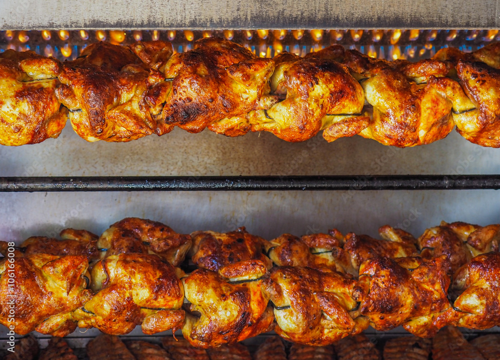 Spit-roasted rotisserie chickens