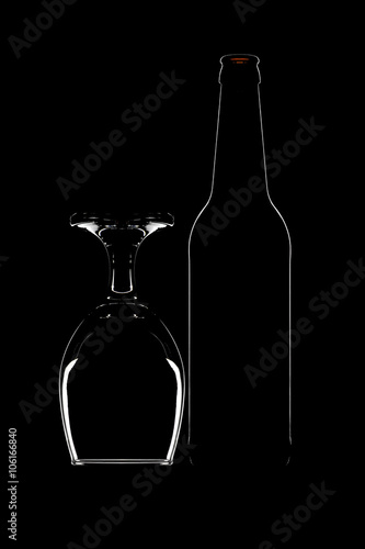 Contour of beer bottle and beer glass on black