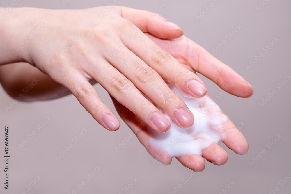 Women washing of hands with soap foam ,nice soft background Women washing of hands with soap foam ,nice soft background