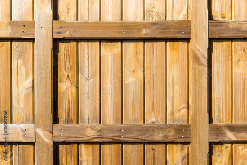 Section of natural colour wood panelling from a beach hut  suitable for backgrounds of gardening themes. The shape could also be adapted as a picture frame.