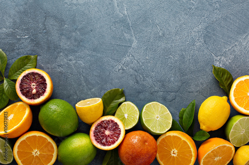Fotografija Citrus fruits background with oranges, limes and lemons