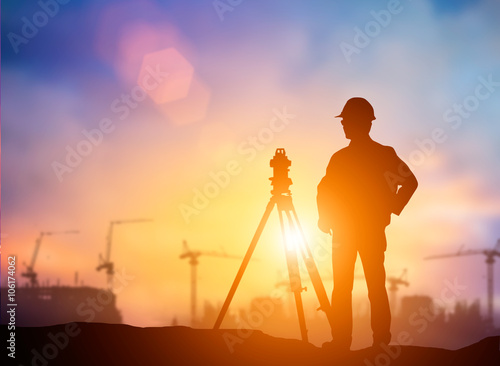 silhouette The young engineer working construction standards in