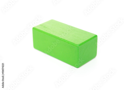 piece of green wooden toy block on white background © Freer
