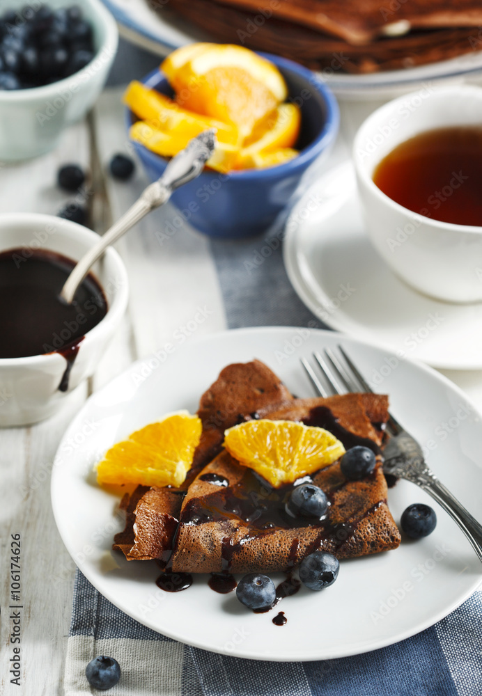 Chocolate crepes with blueberries and orange Chocolate crepes with blueberries and orange