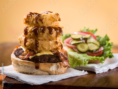 Bacon Cheeseburger with stack of onion rings