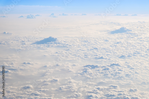 Clouds and sky, aerial view from airplane window.