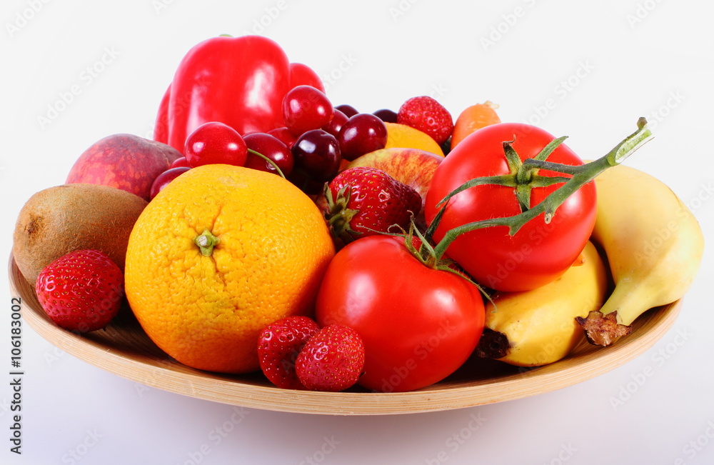Fresh fruits and vegetables on wooden plate Fresh fruits and vegetables on wooden plate