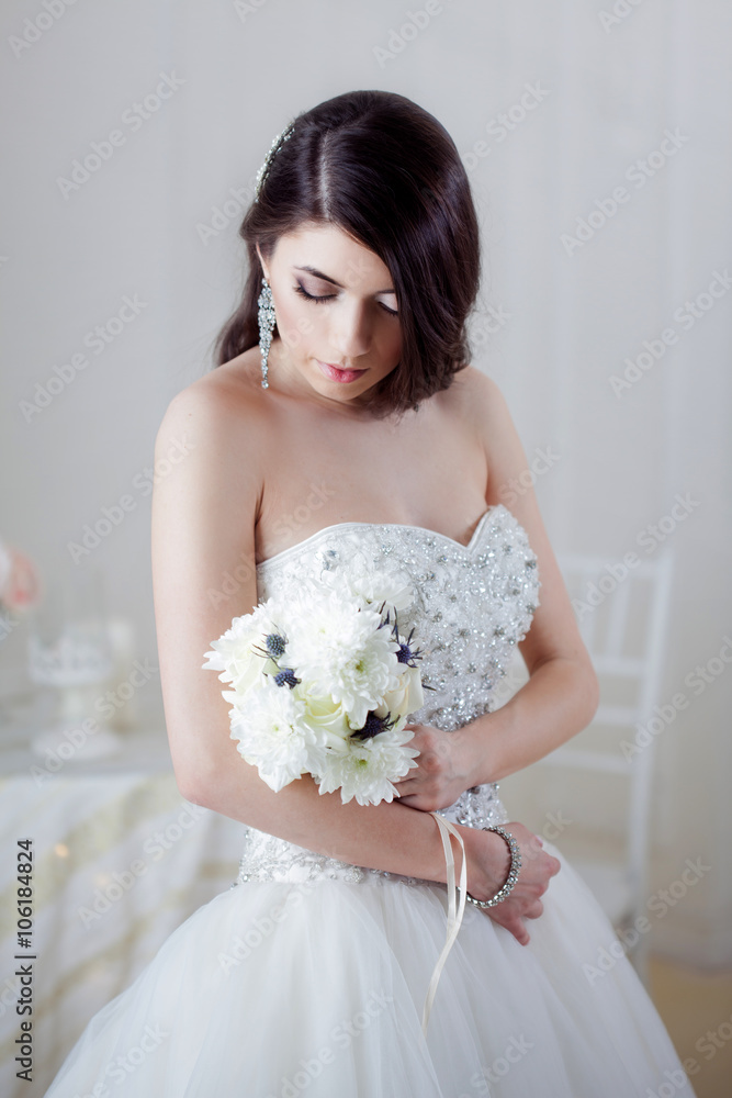 Portrait of beautiful bride. Dress with open back. Wedding decoration Portrait of beautiful bride. Dress with open back. Wedding decoration
