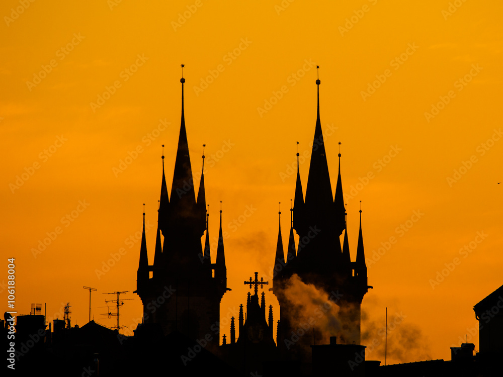 Towers of Tyn church silhouette in morning Prague